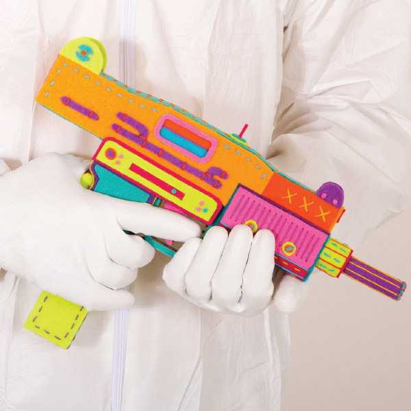 Person holding a multi-colored gun