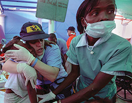 medical workers helping injured person