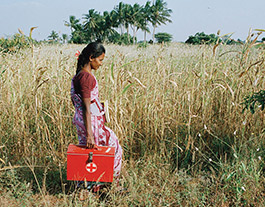 medical worker walking through field