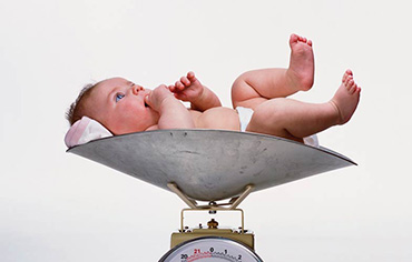 Photo of baby on a scale