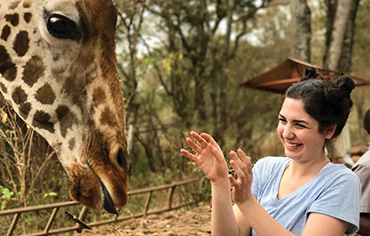 Sydney Glenn with a giraffe