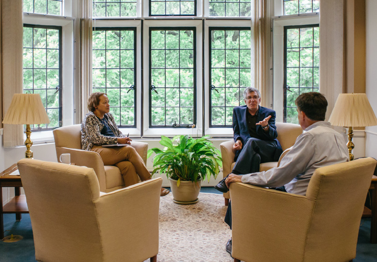 President John Simon talking to Provost Pat Farrell and Patricia Johnson,
Vice President for Finance and Administration