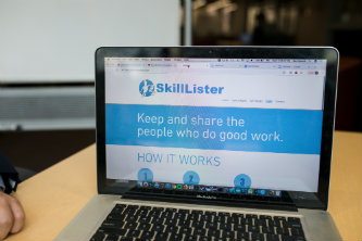 Laptop with screen showing SkillLister website