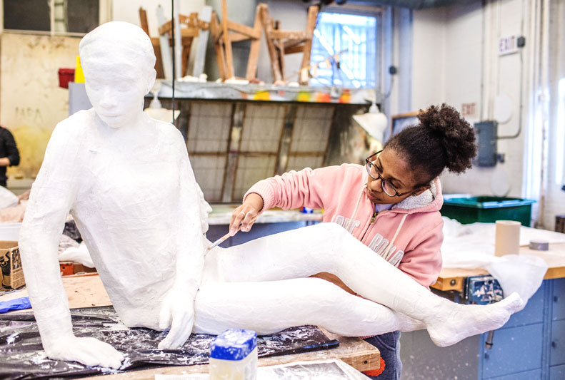 Student sculpting 