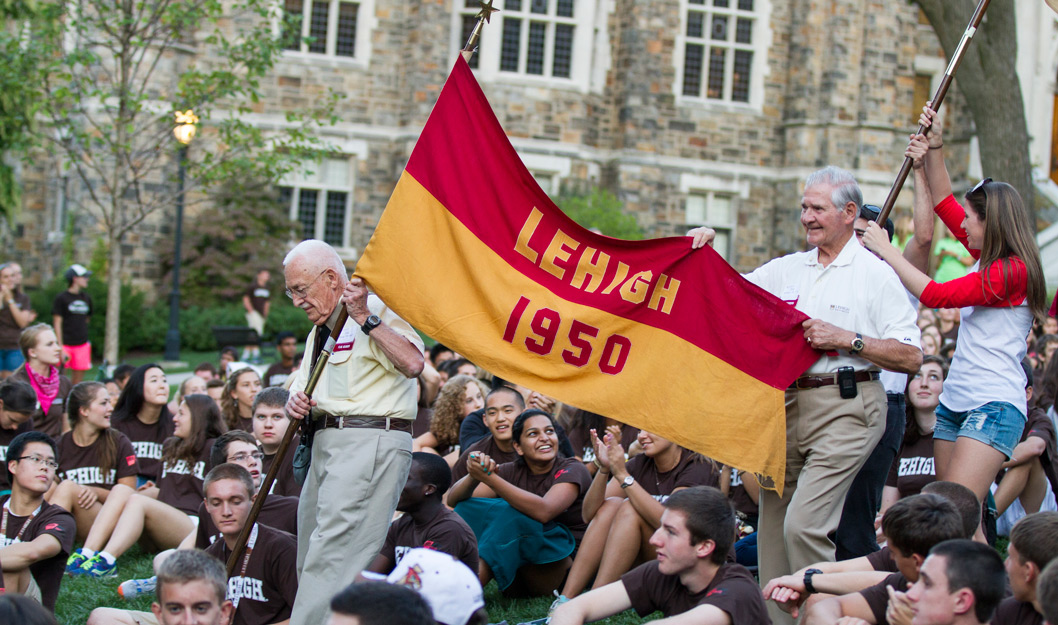 Alumni holding a Lehigh 1950 flag