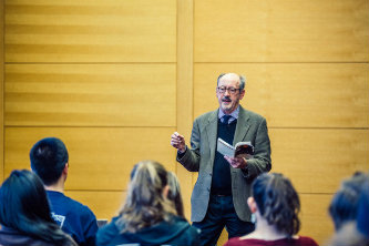 Billy Collins speaking to students