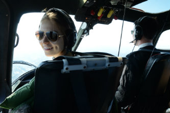 Voronetskaya is making memories as she travels around England. Above, she enjoys a helicopter flight over London.