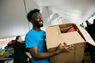 Aarsenio Perry carries a box at Lehigh University's Great South Side Sale
