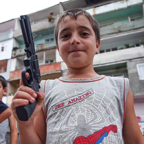 Child holding gun