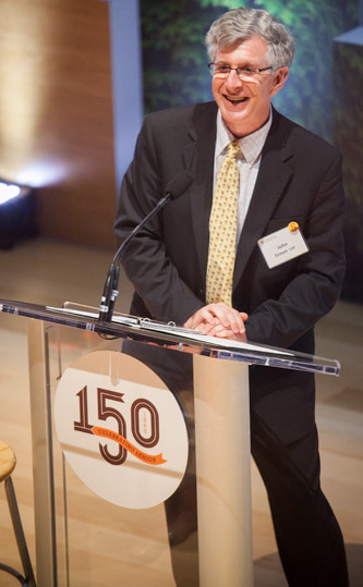 President John Simon speaking at podium