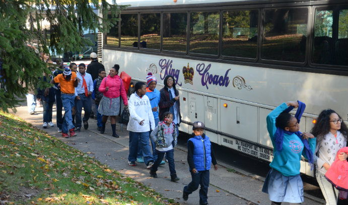 Success Academy students getting off the bus at Lehigh
