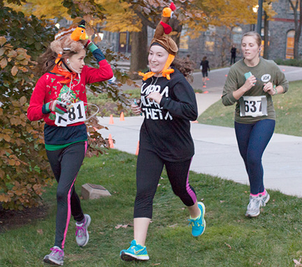 Three people running in the Turkey Trot